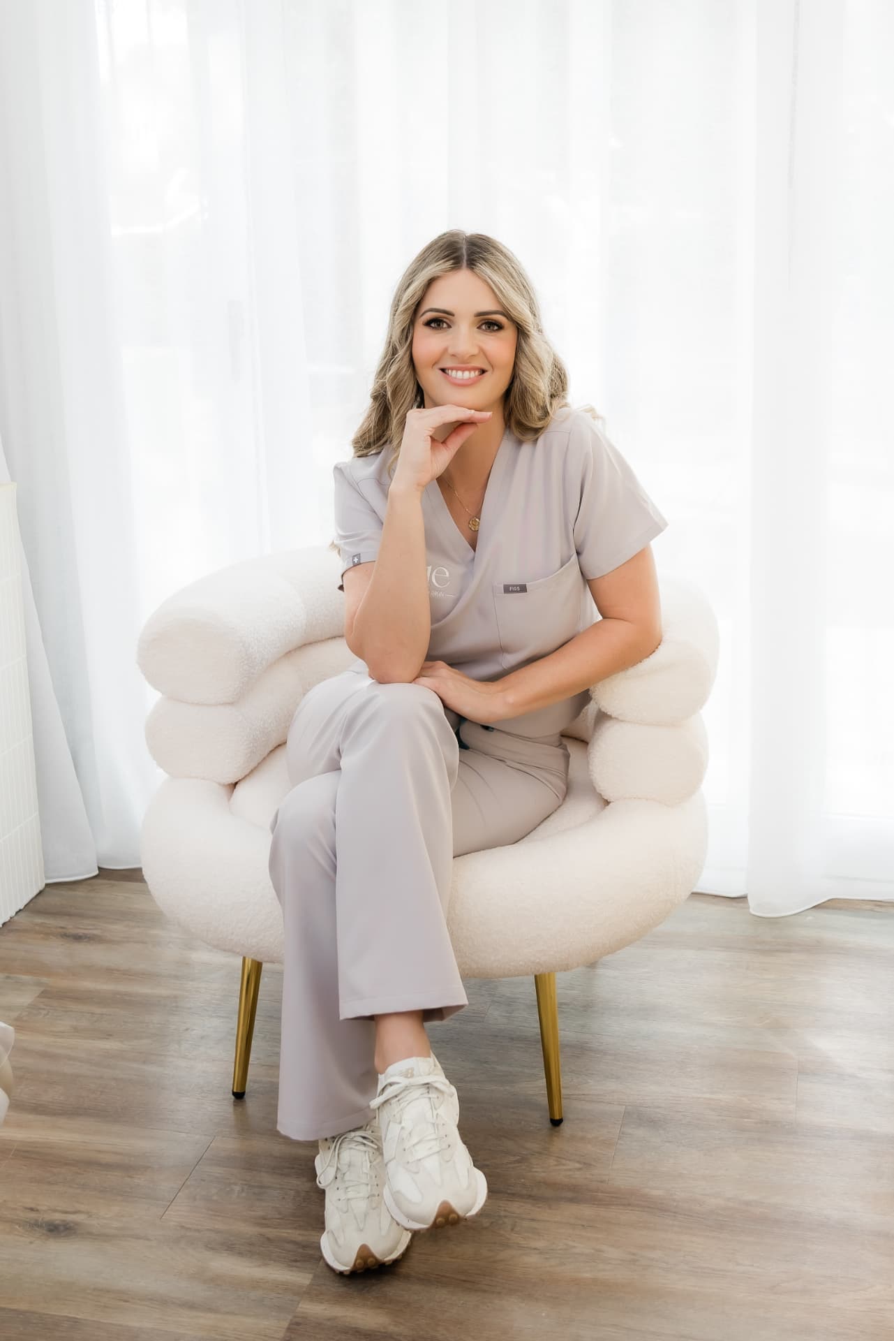 Chantel Conwell, Registered Nurse and founder of Vue Aesthetics + Skin, seated in the North Lakes clinic